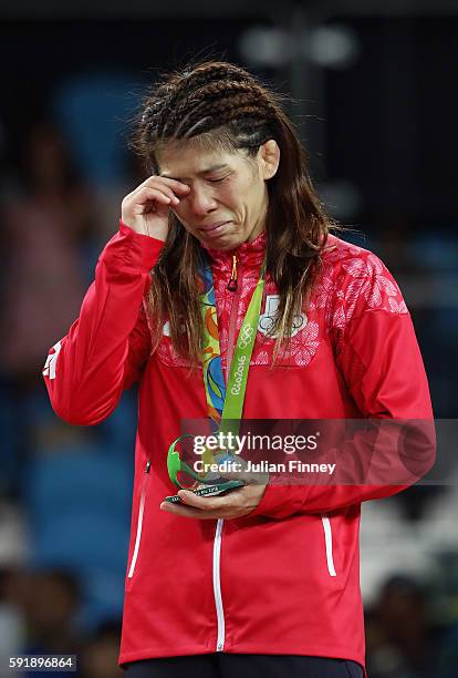 Silver medalist Saori Yoshida of Japan reacts during the medal ceremony after the Women's Freestyle 53 kg competition on Day 13 of the Rio 2016...