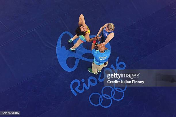 Yekaterina Larionova of Kazakhstan celebrates after defeating Elena Sergey Pirozhkova of the United States during the Women's Freestyle 63 kg Bronze...