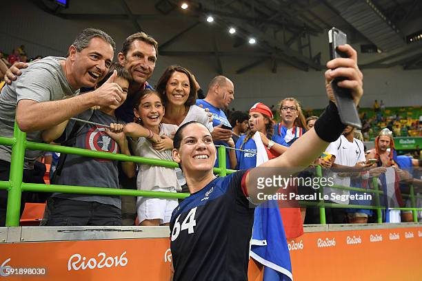Player Alexandra Lacrabere of France takes a selfie with supporters her victory of the women's semifinal handball match Netherlands vs France for the...