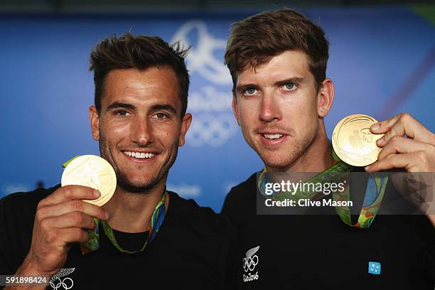 Peter Burling of New Zealand and Blair Tuke of New Zealand celebrate after winning the gold medal in the Men's 49er class at the Marina da Gloria on...