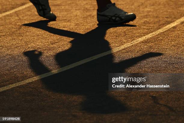An athlete casts as shadow during the Men's Decathlon Pole Vault on Day 13 of the Rio 2016 Olympic Games at the Olympic Stadium on August 18, 2016 in...