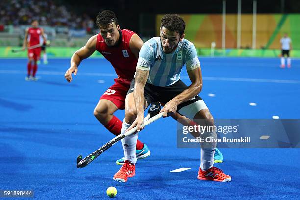 Manuel Brunet of Argentina competes for the ball during the Men's Hockey Gold Medal match between Belgium and Argentina on Day 13 of the Rio 2016...