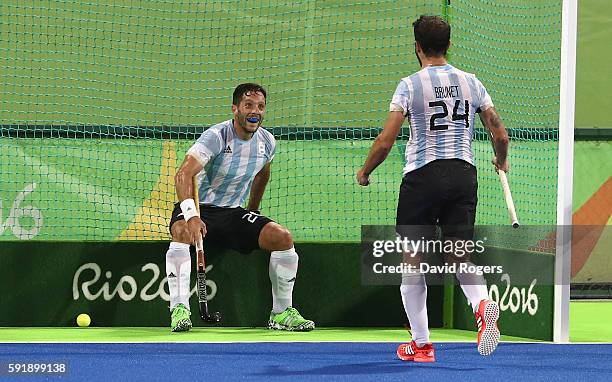 Agustin Mazzilli of Argentina celebrates with team mate Manuel Brunet after scoring their fourth goal during the Men's Gold Medal match between...
