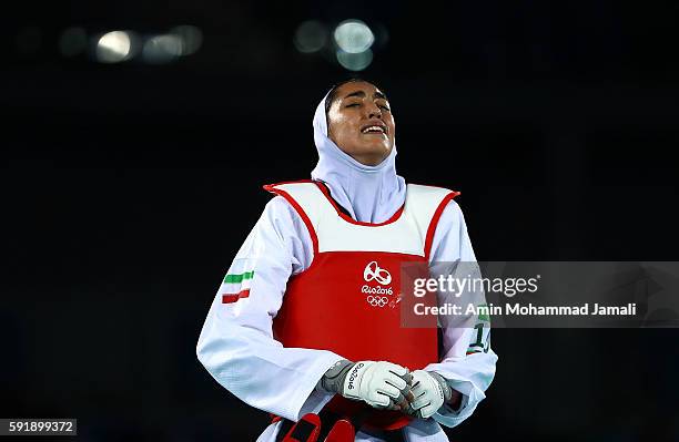 Kimia Alizadeh Zenoorin of Iran cries during the Women's Taekwondo 57kg quarter finals at the Carioca Arena on Day 13 of the 2016 Rio Olympic Games...