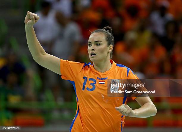 Yvette Broch of Netherlands celebrates a goal during the Women's Handball Semi-final match against France at the Future Arena on Day 13 of the 2016...