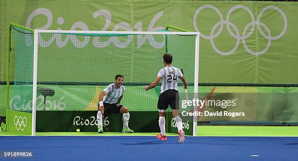 Agustin Mazzilli of Argentina celebrates with team mate Manuel Brunet after scoring their fourth goal during the Men's Gold Medal match between...