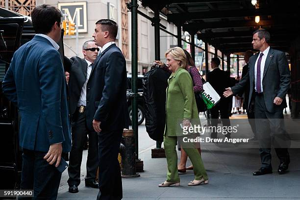 Democratic presidential candidate Hillary Clinton is escorted to her motorcade by U.S. Secret Service agents as she leaves a private meeting at the...