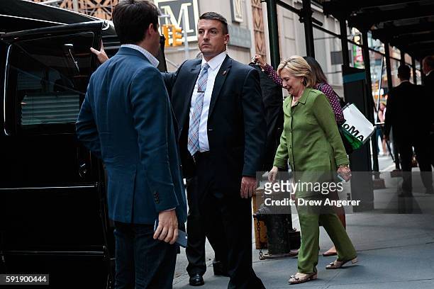 Democratic presidential candidate Hillary Clinton is escorted to her motorcade by U.S. Secret Service agents as she leaves a private meeting at the...