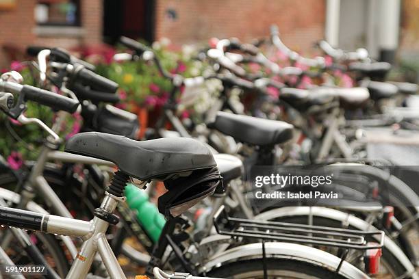 bicycles parked at parking lot - bruselas bildbanksfoton och bilder