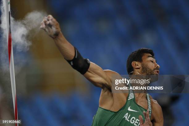 Algeria's Larbi Bourrada competes in the Men's Decathlon Javelin Throw during the athletics event at the Rio 2016 Olympic Games at the Olympic...