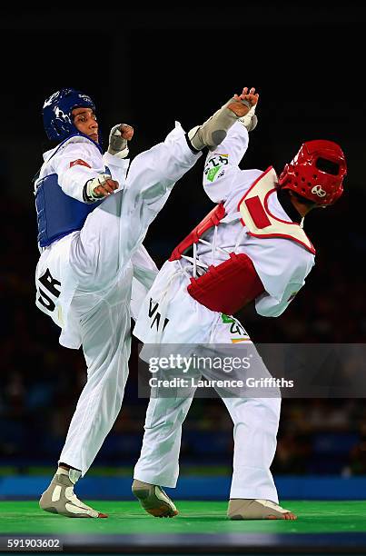 Servet Tazegul of Turkey competes against Edgar Contreras of Venezuela during the men's -68kg Repechage Taekwondo contest at the Carioca Arena on Day...