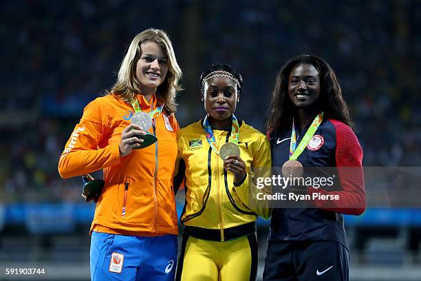 Silver medalist, Dafne Schippers of the Netherlands, gold medalist, Elaine Thompson of Jamaica, and bronze medalist, Tori Bowie of the United States,...