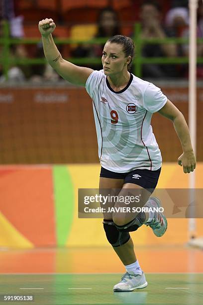 Norway's right back Nora Mork celebrates a goal during the women's semifinal handball match Norway vs Russia for the Rio 2016 Olympics Games at the...