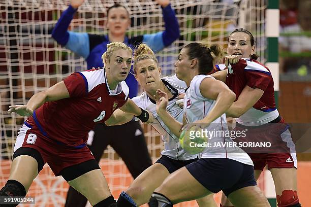 Norway's right back Nora Mork vies with Russia's right back Anna Sen during the women's semifinal handball match Norway vs Russia for the Rio 2016...
