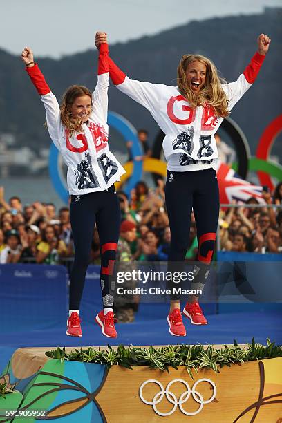 Hannah Mills of Great Britain and Saskia Clark of Great Britain celebrate winning gold in the Women's 470 class at the Marina da Gloria on Day 13 of...