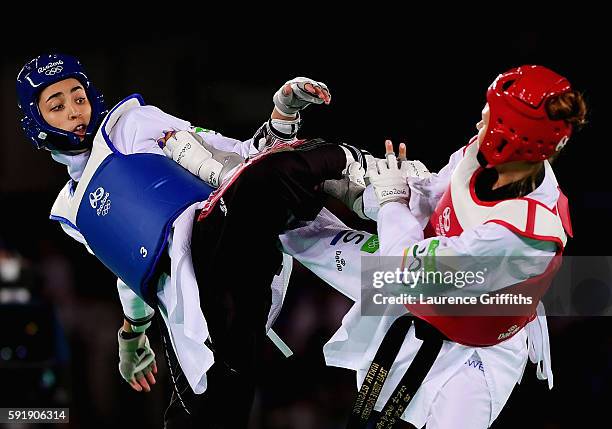 Nikita Glasnovic of Sweden competes against Kimia Alizadeh Zenoorin of the Islamic Republic of Iran during the Women's -57kg Bronze Medal Taekwondo...