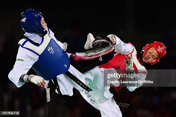 Nikita Glasnovic of Sweden competes against Kimia Alizadeh Zenoorin of the Islamic Republic of Iran during the Women's -57kg Bronze Medal Taekwondo...
