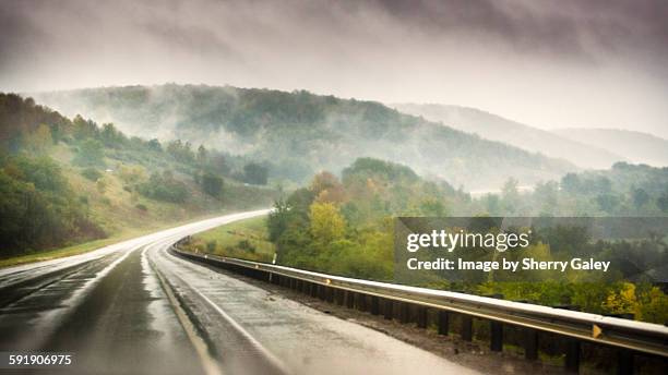 foggy road in the mountains - wv stock pictures, royalty-free photos & images