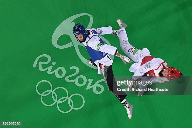 Nikita Glasnovic of Sweden competes against Kimia Alizadeh Zenoorin of the Islamic Republic of Iran during the Women's -57kg Bronze Medal Taekwondo...