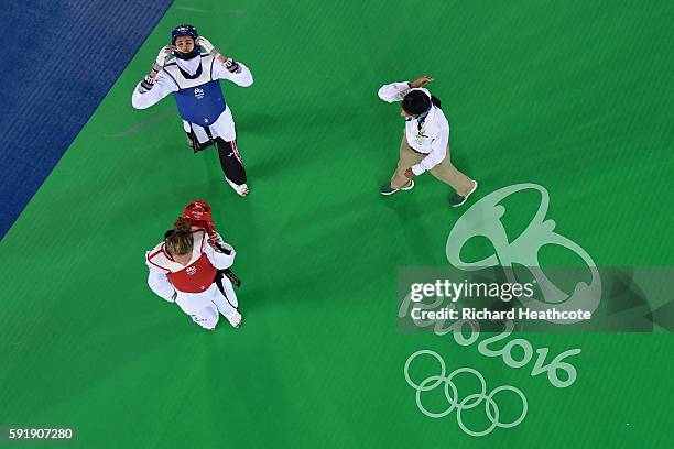 Kimia Alizadeh Zenoorin of the Islamic Republic of Iran celebrates after defeating Nikita Glasnovic of Sweden during the Women's -57kg Bronze Medal...