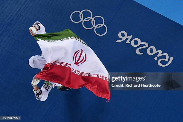 Kimia Alizadeh Zenoorin of the Islamic Republic of Iran celebrates after defeating Nikita Glasnovic of Sweden during the Women's -57kg Bronze Medal...