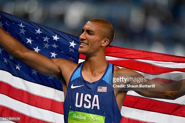Ashton Eaton of the United States celebrates winning gold overall after the Men's Decathlon 1500m on Day 13 of the Rio 2016 Olympic Games at the...