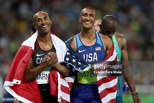 Gold medalist Ashton Eaton of the United States celebrates with silver medalist Damian Warner of Canada after the Men's Decathlon 1500m on Day 13 of...