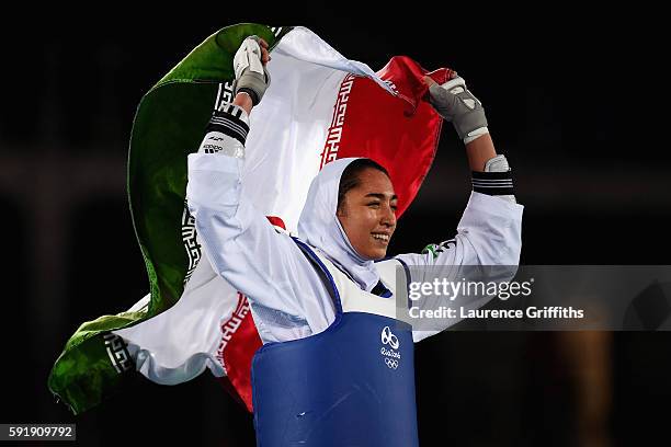 Kimia Alizadeh Zenoorin of the Islamic Republic of Iran celebrates after defeating Nikita Glasnovic of Sweden during the Women's -57kg Bronze Medal...