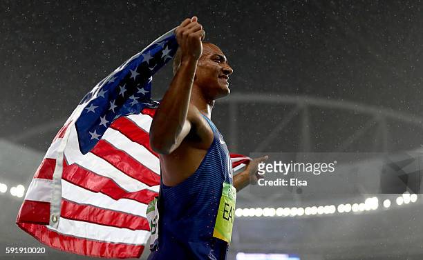 Ashton Eaton of the United States celebrates winning gold overall after the Men's Decathlon 1500m on Day 13 of the Rio 2016 Olympic Games at the...