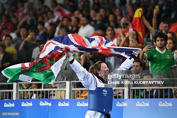 Great Britain's Jade Jones celebrates after winning against Spain's Eva Calvo Gomez in the womens taekwondo gold medal bout in the -57kg category as...