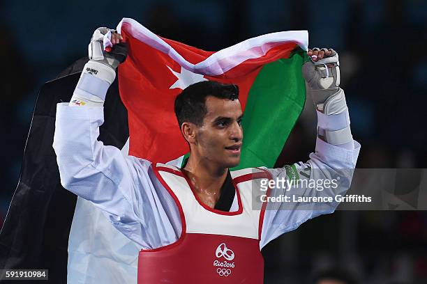 Ahmad Abughaush of Jordan celebrates after defeating Alexey Denisenko of Russia during the men's -68kg Gold Medal Taekwondo contest at the Carioca...