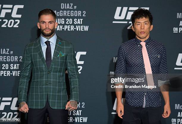 Cody Garbrandt and Takeya Mizugaki pose for a picture during the UFC 202 Ultimate Media Day at the Red Rock Casino Resort on August 18, 2016 in Las...