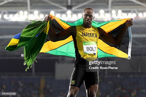 Usain Bolt of Jamaica celebrates winning the Men's 200m Final on Day 13 of the Rio 2016 Olympic Games at the Olympic Stadium on August 18, 2016 in...