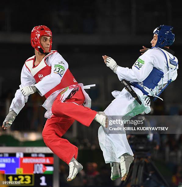 Russia's Alexey Denisenko competes against Jordan's Ahmad Abughaush during the men's taekwondo gold medal bout in the -68kg category as part of the...