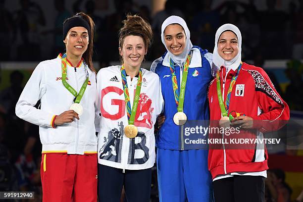 Silver medalist Spain's Eva Calvo Gomez, gold medalist Great Britain's Jade Jones, and bronze medalists Iran's Kimia Alizadeh Zenoorin and Egypt's...