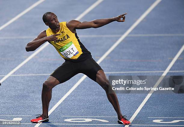 Jamaica's Usain Bolt strikes a familiar pose at the finish line after winning the 200m at the Summer Olympics on Thursday, Aug. 18 in Rio de Janeiro,...