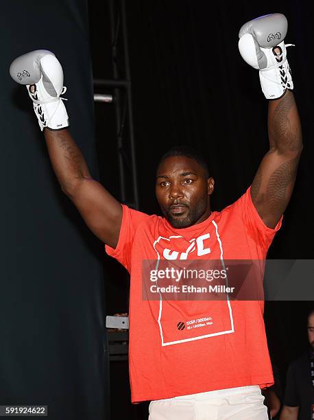 Mixed martial artist Anthony Johnson gestures as he arrives at an open workout for UFC 202 at Rocks Lounge at the Red Rock Casino on August 18, 2016...