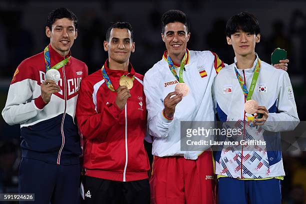 Silver medalist Alexey Denisenko of Russia, gold medalist Ahmad Abughaush of Jordan, Bronze medalists Daehoon Lee of the Republic of Korea and Joel...