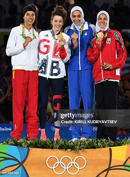 Silver medalist Spain's Eva Calvo Gomez, gold medalist Great Britain's Jade Jones, and bronze medalists Iran's Kimia Alizadeh Zenoorin and Egypt's...