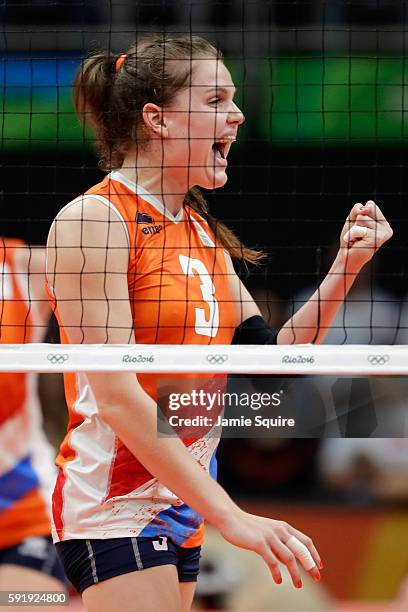 Yvon Belien of Netherlands celebrates a point over China during the Women's Volleyball Semifinal match at the Maracanazinho on Day 13 of the 2016 Rio...