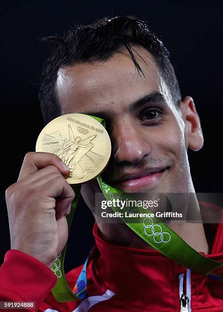 Gold medalist, Ahmad Abughaush of Jordan celebrates on the podium after the men's -68kg Gold Medal Taekwondo contest at the Carioca Arena on Day 13...