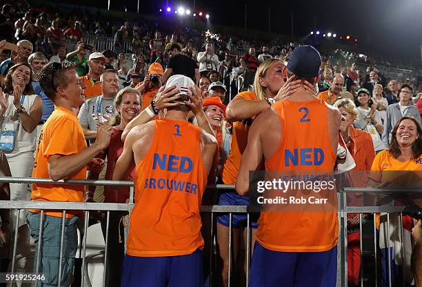 Alexander Brouwer and Robert Meeuwsen of the Netherlands celebrate with the fans winning the Men's Beach Volleyball Bronze medal match against...