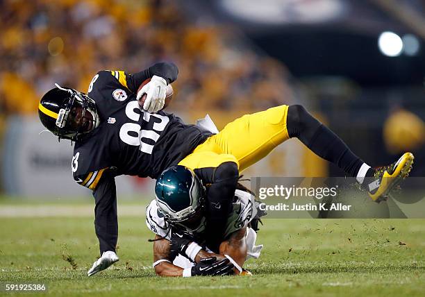 Canaan Severin of the Pittsburgh Steelers is tackled after making a catch by Jaylen Watkins of the Philadelphia Eagles during a preseason game on...