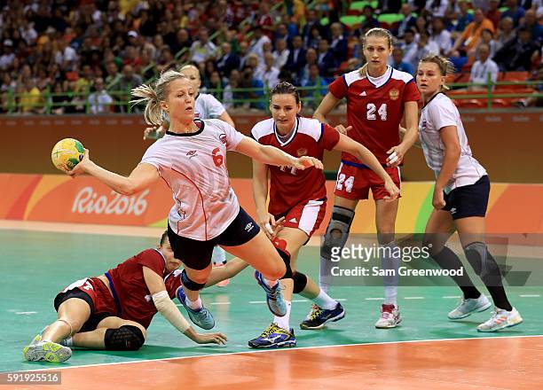 Heidi Loke of Norway attempts a shot during the Women's Handball Semi-final match against Russia at the Future Arena on Day 13 of the 2016 Rio...