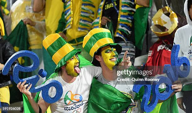 Fans enjoy the atmosphere during the Men's Beach Volleyball Gold medal match between Paolo Nicolai and Daniele Lupo of Italy and Alison Cerutti and...