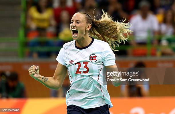 Camilla Herrem of Norway reacts after a goal during the Women's Handball Semi-final match against Russia at the Future Arena on Day 13 of the 2016...