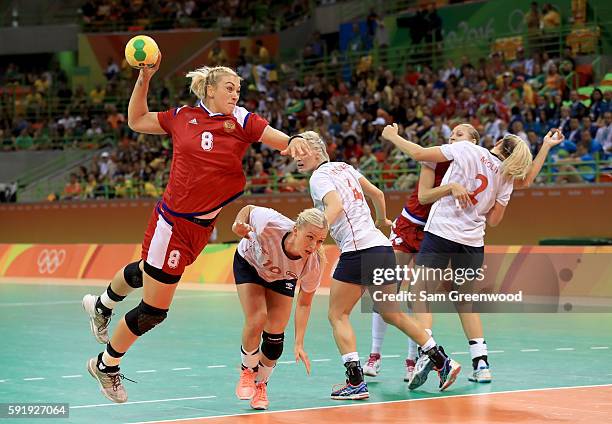 Anna Sen of Russia attempts a shot during the Women's Handball Semi-final match against Norway at the Future Arena on Day 13 of the 2016 Rio Olympic...