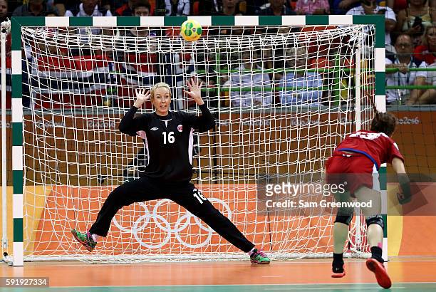 Ekaterina Ilina of Russia attempts a shot against Katrine Lunde of Norway during the Women's Handball Semi-final match at the Future Arena on Day 13...