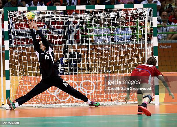 Ekaterina Ilina of Russia attempts a shot against Katrine Lunde of Norway during the Women's Handball Semi-final match at the Future Arena on Day 13...