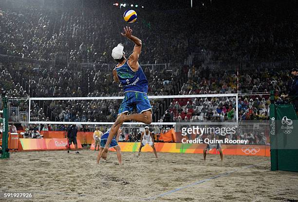 Bruno Schmidt Oscar of Brazil serves the ball during the Men's Beach Volleyball Gold medal match against Paolo Nicolai and Daniele Lupo of Italy at...